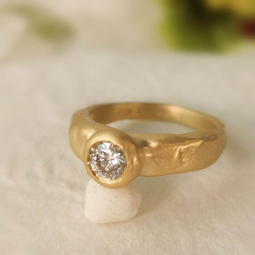 bezel set moissanite gold ring