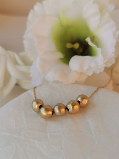 large gold beads necklace