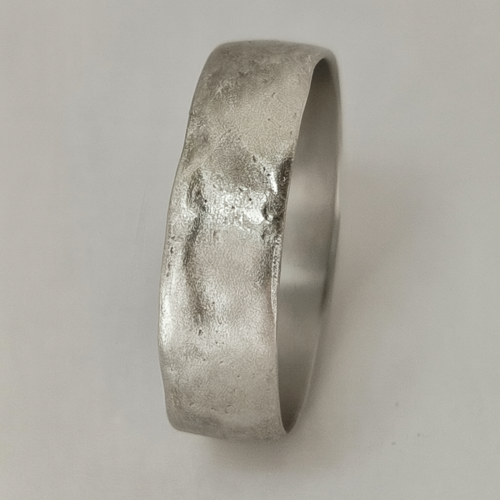 Silver ring with a textured surface 